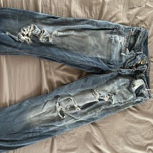 Dark blue jeans lots of ripped holes